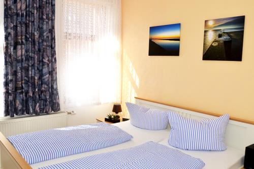 Borkum Ferienhaus Daheim - Schlafzimmer 1