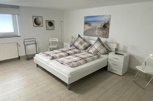 Borkum Ferienhaus Nordseeperle - Schlafzimmer mit Doppelbett