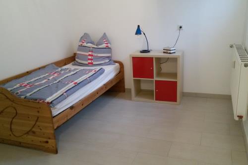 Borkum Ferienwohnung Deichterrasse - Schlafzimmer - Einzelbett