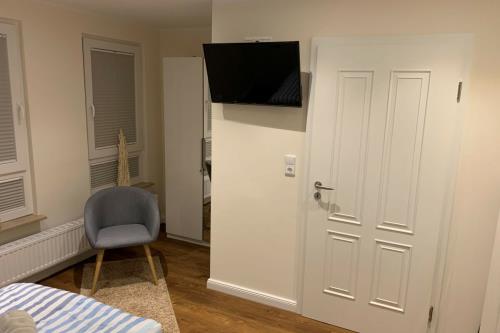 Borkum Ferienwohnung Nordblick ehemals Muske - Schlafzimmer mit Fernseher