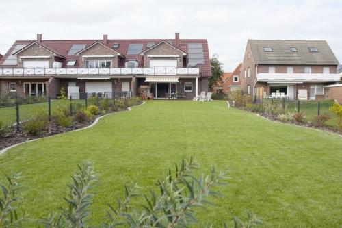 Borkum Ferienwohnung Strandkoje - aussenansicht mit garten