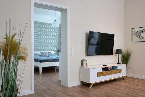 Borkum Ferienwohnung Sommerköken - Wohnzimmer mit Flachbild-TV