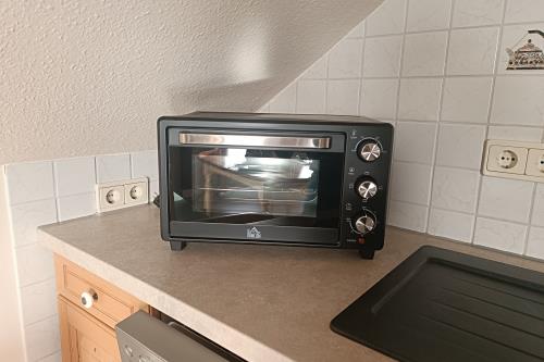 Borkum Ferienwohnung Villa Harmonie - Wohnung Jasmin - kleiner Brötchen und Pizzaofen