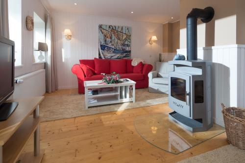Borkum Ferienhaus et Lootsje - Wohnbereich mit Kamin