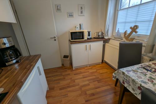 Borkum Haus Ites - Ferienwohnungen Anker und Möwe - PXL 20250409 062544095