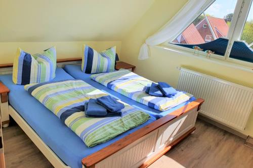 Langeoog Ferienwohnung Ferienhaus Katja und Ralf Heimes - 2 - Schlafen Eltern DG