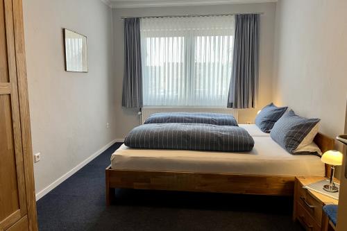 Langeoog Ferienwohnung Ferienhaus Sülvern Wind - L 01 - Schlafzimmer 1