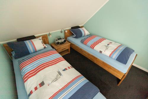 Langeoog Ferienwohnung Ferienhaus Sülvern Wind - L 01 - Schlafzimmer 2