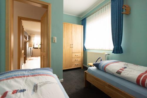 Langeoog Ferienwohnung Ferienhaus Sülvern Wind - R 02 - Schlafzimmer_2