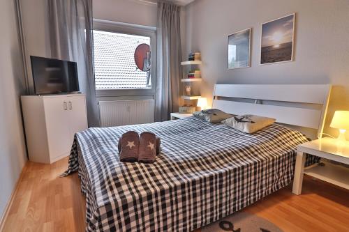 Langeoog Vermietung am Meer – Ferienwohnung Salini - Schlafzimmer 1