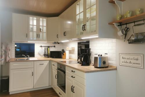 Langeoog Ferienwohnung Haus Dinkla - Wohnung unten - Küche mit Backofen und Spülmaschine