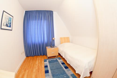 Langeoog Ferienwohnung Fylgja - Schlafzimmer mit Einzelbett