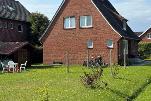 Langeoog Ferienwohnung Us Langeoog - Haus Bodman - Hausansicht Garten