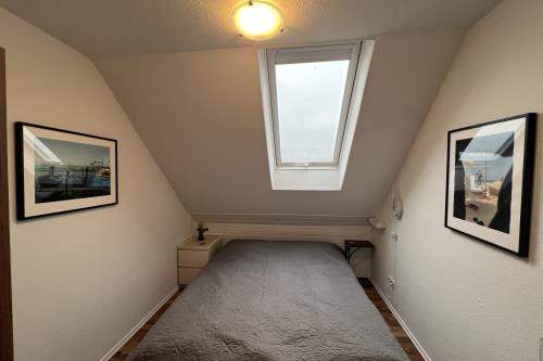 Langeoog Ferienwohnung Haus Apollonia - Wohnung 5 - Schlafzimmer mit Doppelbett