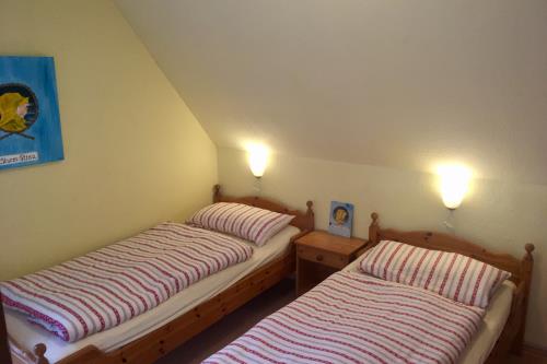 Langeoog Ferienwohnung Inselherz im Haus am Kurzentrum - Schlafzimmer