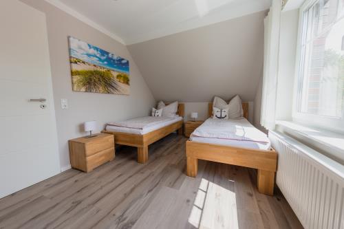Langeoog Ferienhaus Inselzauber Langeoog FH***** - Schlafzimmer 2 mit 2 Betten