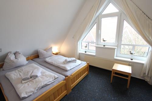 Langeoog Ferienhaus Karkpolder Residenz Haus 3 - Schlafzimmer 1