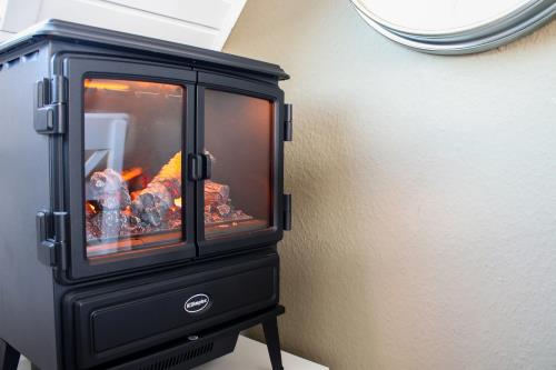 Langeoog Ferienwohnung Vermietung am Meer – Langeooger Viermaster - Gelbes Segel - Kaminofen