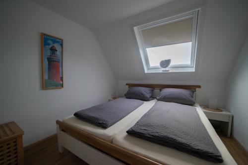 Langeoog Ferienwohnung Muschelsöker - KREBS & KRABBE - Schlafzimmer KREBS