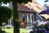 Langeoog Ferienhaus Residenz Inseltraum (Doppelhaushälfte) - Terrasse nach Westen mit Strandkorb