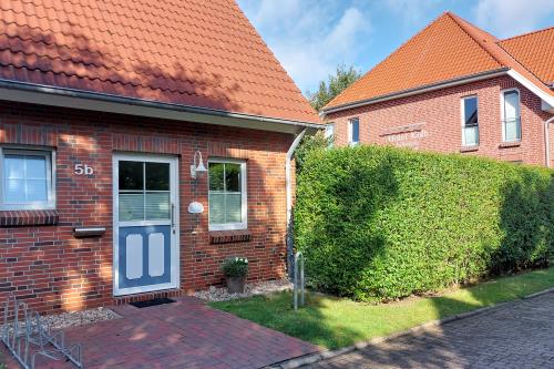 Langeoog Ferienhaus Residenz Inseltraum (Doppelhaushälfte) - Hauseingang Straßenseite