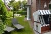 Langeoog Ferienhaus Residenz Inseltraum (Doppelhaushälfte) - Blick durch den geschützten Garten