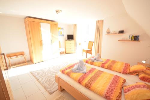 Langeoog Ferienhaus Residenz Süderdünenring FH***** - Merluza - Haus Merluza - Doppelschlafzimmer, 1.OG