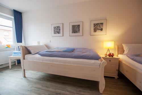 Langeoog Ferienhaus Strandvillen Langeoog - Hus in Lee - Hus in Lee, 1. OG Zweibettzimmer
