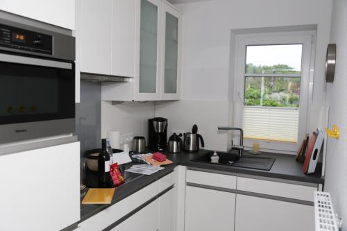 Langeoog Ferienhaus Strandvillen Langeoog - I - SVL I: Küche mit Dünenblick, EG