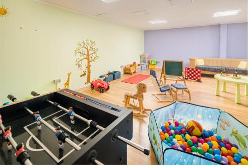 Langeoog Hotel Suitenhotel Idyll Heckenrose ****garni - Spielzimmer