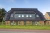Langeoog Ferienhaus Villa Hafenkieker - Frontansicht Haus mit Nebenraum