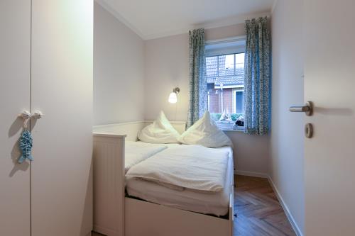 Langeoog Ferienwohnung Zimt & Zucker - Schlafzimmer klein