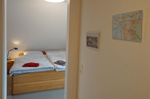 Langeoog Ferienhaus Captain&#39;s Langeoog - 1. OG: Wegweiser zum Doppelzimmer