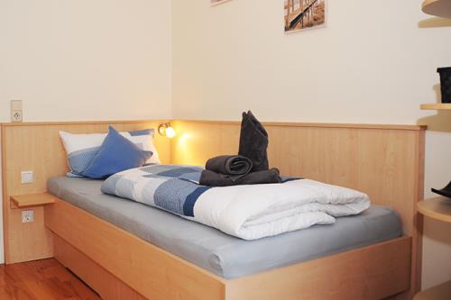 Langeoog Ferienwohnung Inselnüst - Schlafzimmer mit Einzelbett