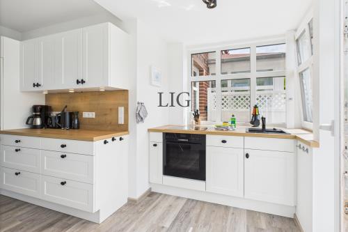 Langeoog Ferienwohnung Haus Norderloog - Captain Carlson - CAM04236G0 PR0050 STILL014