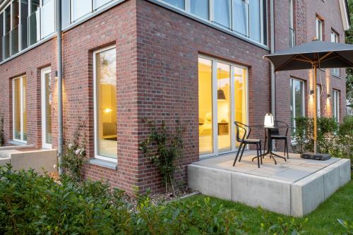 Langeoog Ferienwohnung Lüttje Juweel ***** - Außenansicht und Terrasse