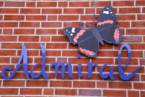 Spiekeroog Ferienwohnung Admiral - Nordlicht - Wand-Logo Admiral