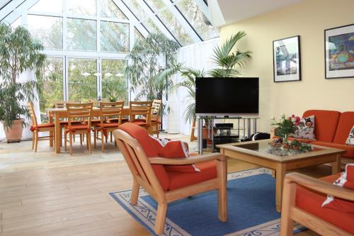 Spiekeroog Ferienwohnung Admiral - Wintergarten - Wohnzimmer mit Wintergarten