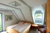 Spiekeroog Ferienwohnung Austernfischer ll, Nr. 1 - Schlafzimmer mit 2 Fenstern