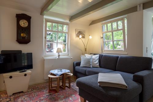 Spiekeroog Ferienwohnung Fam. Hönig - Nord - Wohnzimmer - Sofa