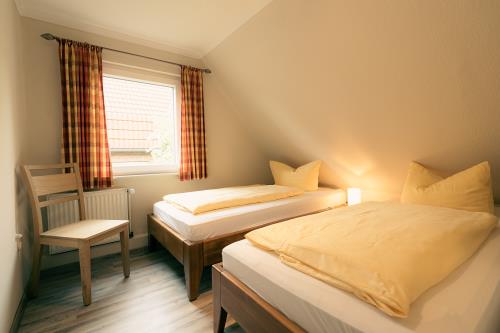 Spiekeroog Ferienwohnung Haus Seeschwalbe Up de Dün - 6 - Schlafzimmer 2