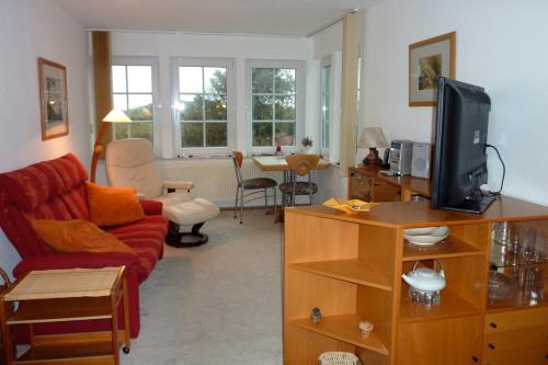 Spiekeroog Ferienwohnung Haus Windrose - OST - OST  Wohnzimmer im Verandastil