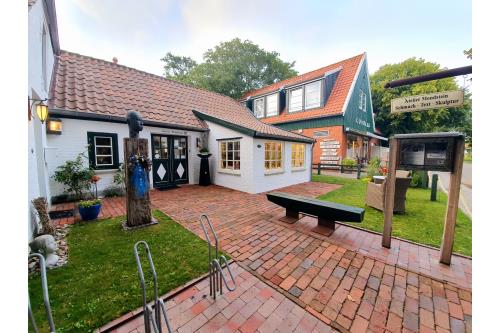 Spiekeroog Ferienwohnung Huus Wellhorn mit Atelier Mondstein - Atelier Eingang mit Wellhornschnecke