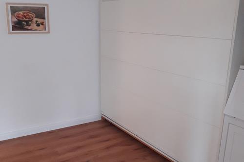 Spiekeroog Ferienwohnung Huus Wester-Tuun - 6 - Foto des Schrankbetts in WG 6