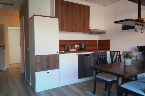 Spiekeroog Ferienwohnung Kamphuus Kajüte - 10/4 - Küche_Essbereich