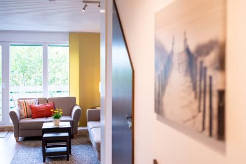 Spiekeroog Ferienwohnung Kamphuus Kajüte - 10/4 - Blick Flur-Wohnbereich