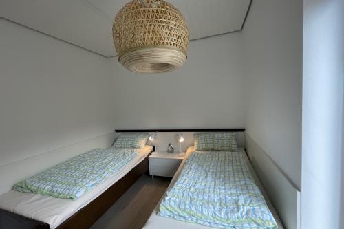 Spiekeroog Ferienwohnung Kamphuus, Whg. 3 - Schlafzimmer mit zwei Einzelbetten