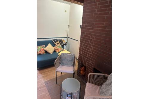 Spiekeroog Ferienwohnung Kieferneck 3 im Spiekerhuus - Wohnbereich und offener Kamin