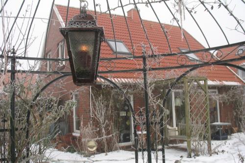 Spiekeroog Ferienwohnung Lütt Paradies - Haus im Winter