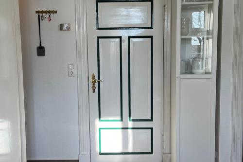 Spiekeroog Ferienwohnung Picks Logierhaus, Whg. 3 - Eingang Wohnzimmer